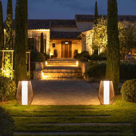 Solar-powered LED lanterns flank a garden path and steps
