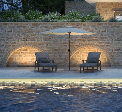 Subtle LED illumination highlights this poolside space